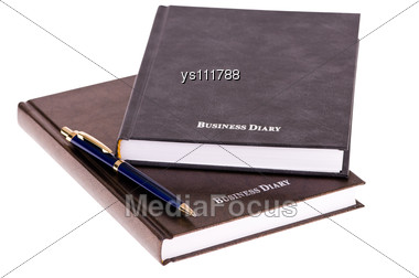 Brown Business Diary With Pen Stock Photo