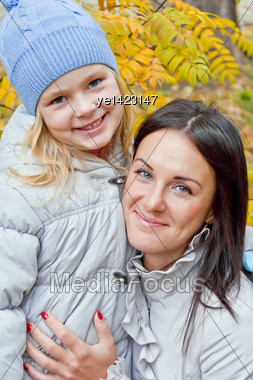 Mother And Daughter In Autumn Stock Photo