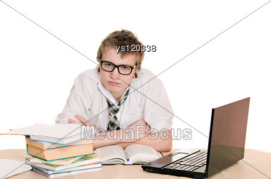 Teenager Student Sits Behind A Desk Stock Photo