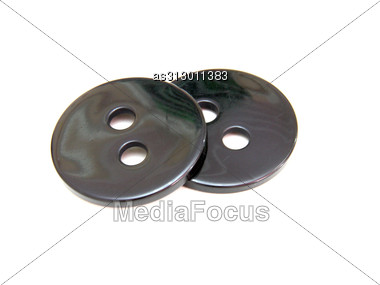 Two Black Buttons Lie Stock Photo