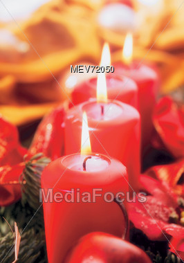 Warmly Lit Red Christmas Candles Stock Photo