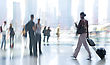 Abstract Image Of A Business People Activity Standing And Walking In The Lobby, Backlit Light From A Window And Intentional Blur And Tint