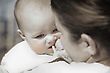 Stock Photo : Adults Mid Stock Image: Baby On Mother's Shoulder