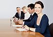 Stock Photo : Conference Table Stock Image: Business Woman Sits at Conference Table with Colleagues