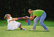 Stock Photo : Smiling Pictures: Father and Dauther Playing Outdoors