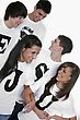 Five Teenagers With T-shirts Spelling Jesus