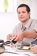 Stock Photo : Machines Stock Photo: Man Eating Raclette