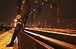 Stock Photo : Hanging Pictures: Man Sits On Side Of Bridge