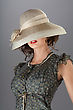 Stock Photo : Face Stock Photo: Portrait Of An Elegant Pretty Woman Hiding Her Eyes Under A Beige Vintage Hat