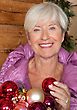 Stock Photo : Mature Stock Image: Senior Woman With Christmas Ornaments