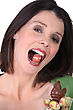 Stock Photo : Ap Funny Stock Image: Woman With An Easter Egg In The Mouth