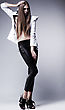 Stock Photo : Pose Stock Photo: Young Brunette Lady In Black Leggings Posing On Grey Background. Glamour, Beauty Style