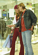 Young Couple Shopping At Mall